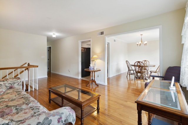 3852 Heimbaugh Ln, Lexington, KY 40514 - living room featuring wood finished floors and a chandelier