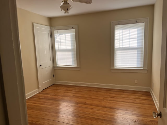 1134 Liberty Rd, Lexington, KY 40505 - empty room featuring light wood finished floors, plenty of natural light, and ceiling fan