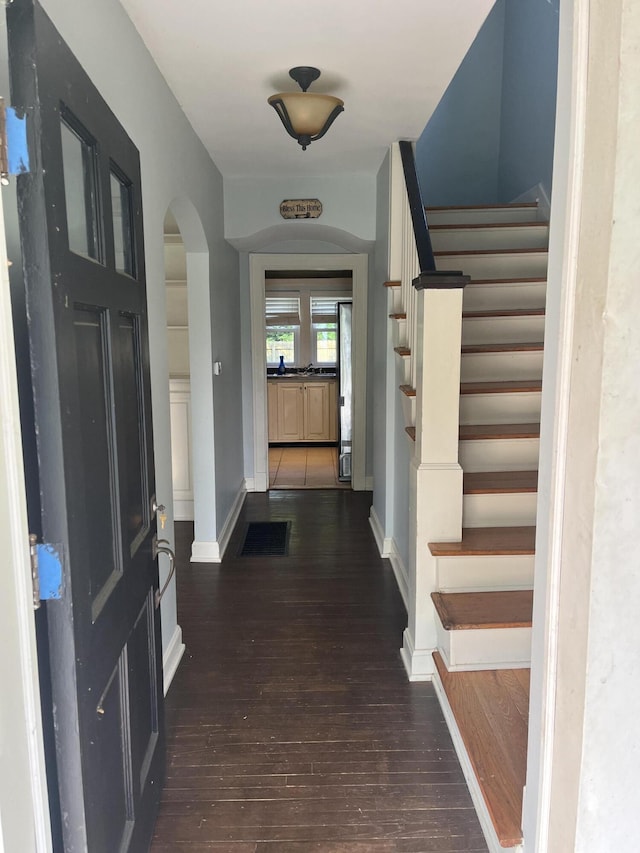 1134 Liberty Rd, Lexington, KY 40505 - entrance foyer featuring stairs, hardwood / wood-style flooring, and arched walkways