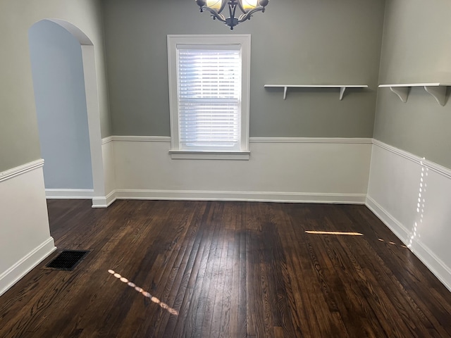 1134 Liberty Rd, Lexington, KY 40505 - unfurnished dining area featuring arched walkways, wood finished floors, and a chandelier