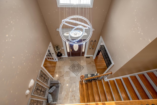 315 Whispering Brook Dr, Nicholasville, KY 40356 - entrance foyer featuring a high ceiling, a chandelier, and a fireplace