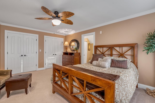 315 Whispering Brook Dr, Nicholasville, KY 40356 - bedroom with light colored carpet, two closets, crown molding, and ceiling fan
