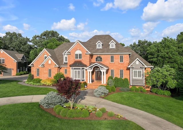 315 Whispering Brook Dr, Nicholasville, KY 40356 - colonial inspired home with brick siding and a front lawn