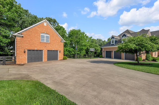 315 Whispering Brook Dr, Nicholasville, KY 40356 - view of side of property featuring brick siding, concrete driveway, and a garage