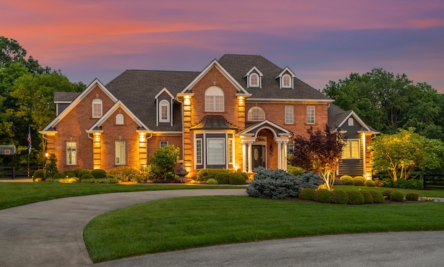 315 Whispering Brook Dr, Nicholasville, KY 40356 - georgian-style home featuring brick siding and a front lawn