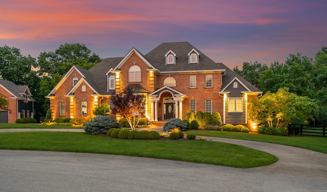 315 Whispering Brook Dr, Nicholasville, KY 40356 - colonial-style house featuring brick siding and a front lawn