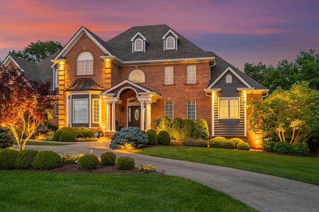 315 Whispering Brook Dr, Nicholasville, KY 40356 - colonial-style house featuring brick siding, a front lawn, and a shingled roof