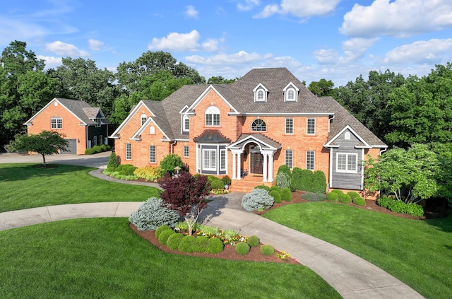 315 Whispering Brook Dr, Nicholasville, KY 40356 - colonial inspired home with brick siding, a front lawn, and concrete driveway