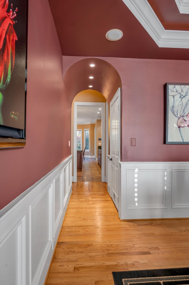 315 Whispering Brook Dr, Nicholasville, KY 40356 - corridor featuring a decorative wall, arched walkways, wainscoting, light wood finished floors, and recessed lighting