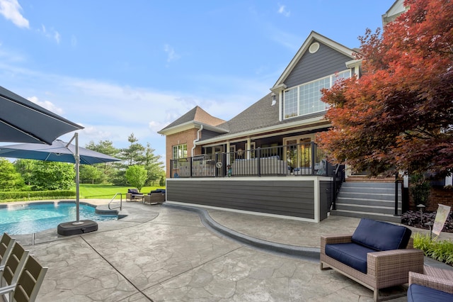 315 Whispering Brook Dr, Nicholasville, KY 40356 - back of property with a patio area, an outdoor pool, stairs, and a shingled roof