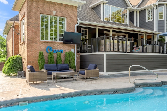 315 Whispering Brook Dr, Nicholasville, KY 40356 - rear view of house with brick siding, outdoor lounge area, and a patio area