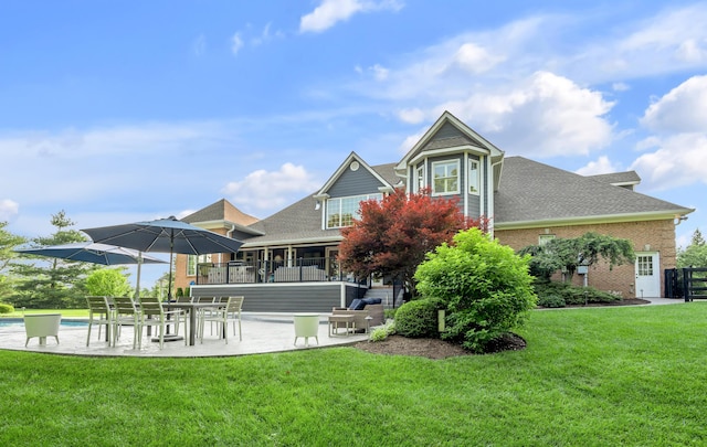 315 Whispering Brook Dr, Nicholasville, KY 40356 - rear view of property featuring a patio area, a lawn, a shingled roof, and an outdoor pool