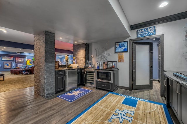 315 Whispering Brook Dr, Nicholasville, KY 40356 - indoor bar featuring fridge, stainless steel microwave, wine cooler, wood finished floors, and recessed lighting