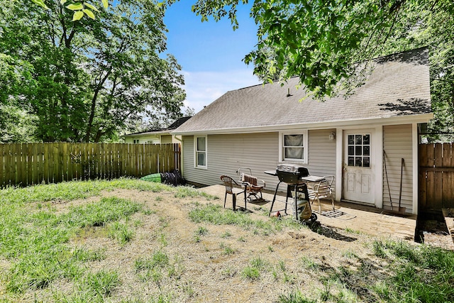 224 E Higgins St, Midway, KY 40347 - back of house with a fenced backyard, a patio area, and roof with shingles