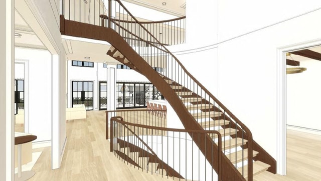 2565 Northwind Ln, Lexington, KY 40511 - staircase featuring wood finished floors and a towering ceiling
