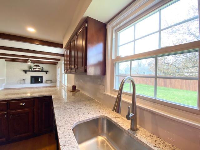 2929 Waco Rd, Lexington, KY 40503 - kitchen featuring dark brown cabinetry, light stone countertops, beam ceiling, and recessed lighting