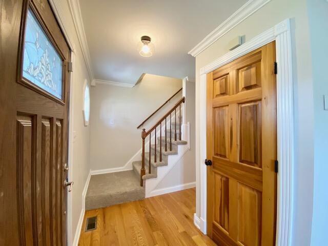 2929 Waco Rd, Lexington, KY 40503 - entrance foyer with ornamental molding, stairway, and light wood-style flooring