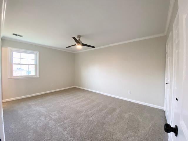2929 Waco Rd, Lexington, KY 40503 - carpeted spare room with ornamental molding and a ceiling fan