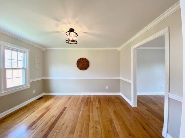 2929 Waco Rd, Lexington, KY 40503 - spare room featuring wood finished floors, ornamental molding, and a chandelier