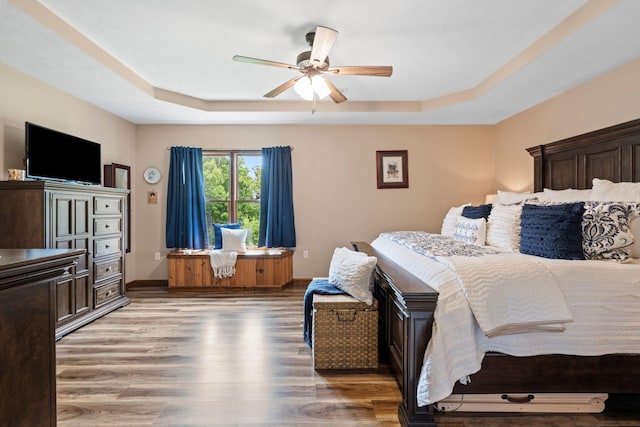 200 Maxwell Ln, Somerset, KY 42503 - bedroom featuring a raised ceiling, light wood finished floors, and a ceiling fan
