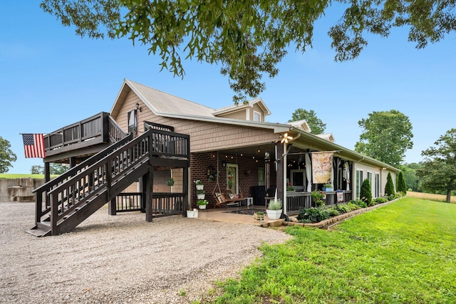 200 Maxwell Ln, Somerset, KY 42503 - rear view of property with a deck, a lawn, stairs, a patio area, and brick siding