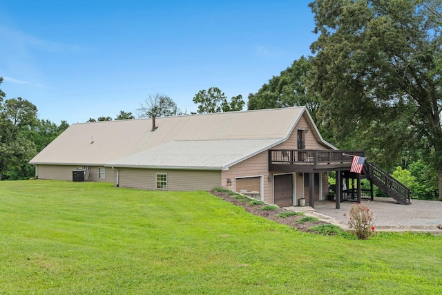 200 Maxwell Ln, Somerset, KY 42503 - rear view of house with stairs, a wooden deck, a yard, and a garage