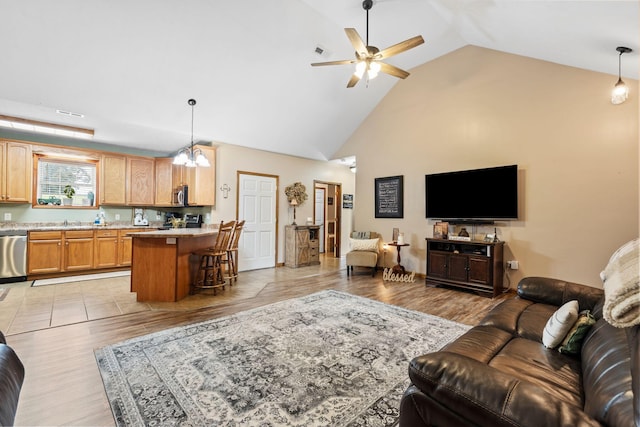200 Maxwell Ln, Somerset, KY 42503 - living area featuring ceiling fan, high vaulted ceiling, and light wood-type flooring