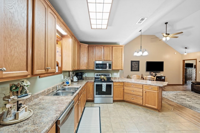 200 Maxwell Ln, Somerset, KY 42503 - kitchen featuring stainless steel appliances, open floor plan, a peninsula, ceiling fan, and pendant lighting