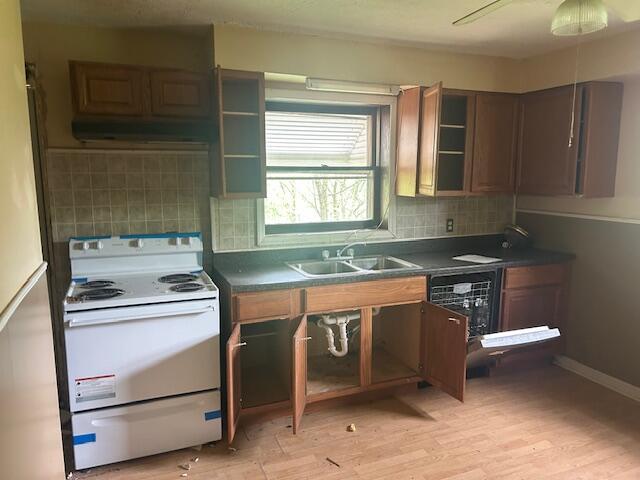 977 Muddy Creek Rd, Winchester, KY 40391 - kitchen with white range with electric cooktop, exhaust hood, dark countertops, and tasteful backsplash