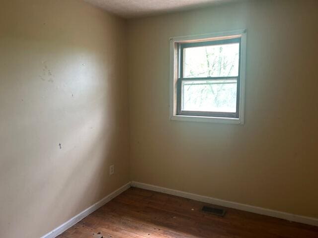 977 Muddy Creek Rd, Winchester, KY 40391 - spare room featuring wood finished floors and baseboards