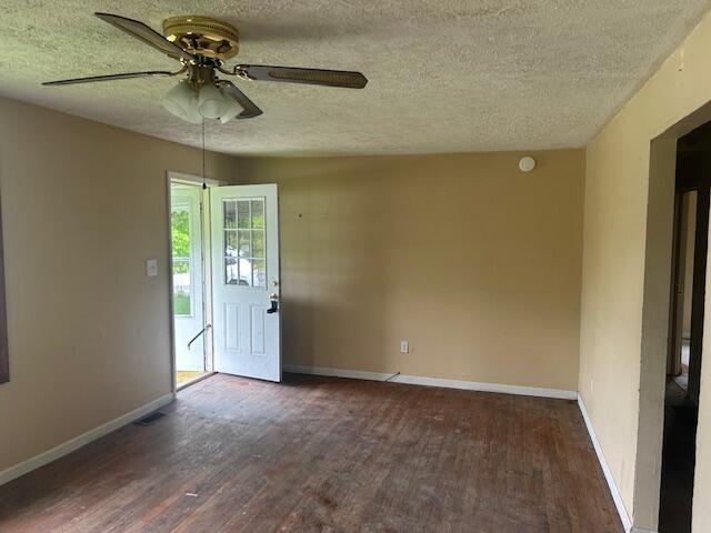 977 Muddy Creek Rd, Winchester, KY 40391 - empty room with a textured ceiling, wood finished floors, and ceiling fan