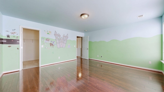 705 Dawson Springs Way, Lexington, KY 40511 - unfurnished bedroom with hardwood / wood-style flooring, a spacious closet, and a closet