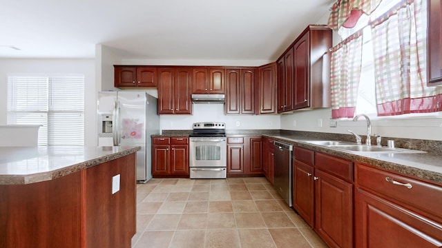 705 Dawson Springs Way, Lexington, KY 40511 - kitchen featuring stainless steel appliances, healthy amount of natural light, under cabinet range hood, and light tile patterned floors