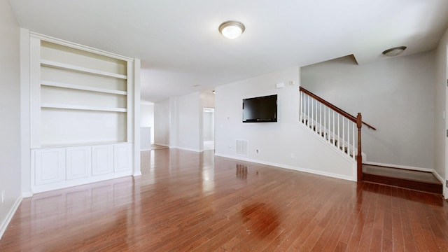 705 Dawson Springs Way, Lexington, KY 40511 - unfurnished living room featuring stairs, wood finished floors, and built in shelves