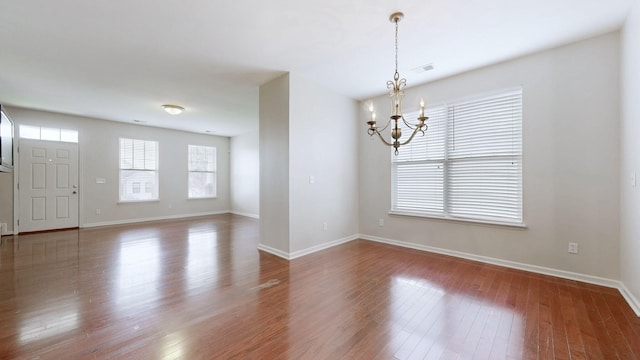 705 Dawson Springs Way, Lexington, KY 40511 - spare room featuring a chandelier and wood finished floors
