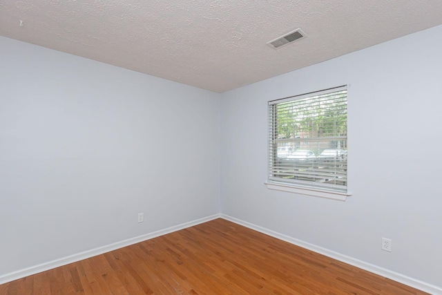 421 Redding Rd Unit 99, Lexington, KY 40517 - empty room featuring wood finished floors and a textured ceiling