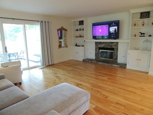 13 Scotland Dr, Frankfort, KY 40601 - living room with light wood finished floors, built in features, a tile fireplace, and ornamental molding