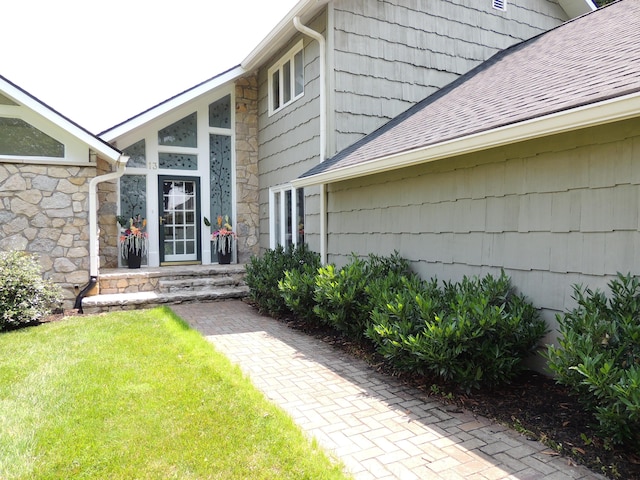 13 Scotland Dr, Frankfort, KY 40601 - property entrance featuring stone siding, roof with shingles, and a lawn