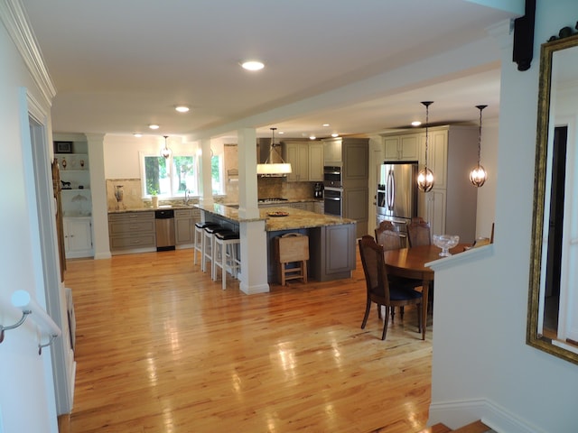 13 Scotland Dr, Frankfort, KY 40601 - kitchen featuring a kitchen breakfast bar, stainless steel refrigerator with ice dispenser, tasteful backsplash, light wood-style flooring, and recessed lighting