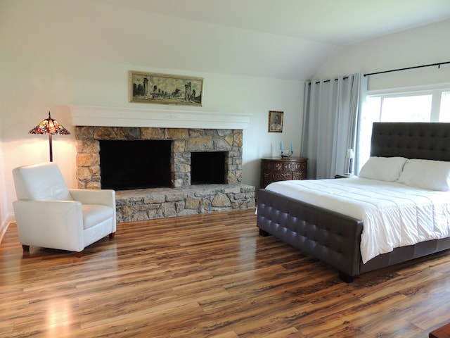 13 Scotland Dr, Frankfort, KY 40601 - bedroom featuring lofted ceiling, wood finished floors, and a stone fireplace