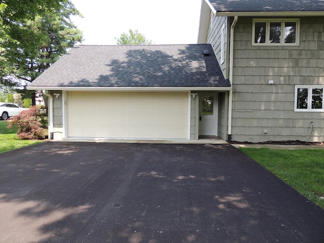 13 Scotland Dr, Frankfort, KY 40601 - view of front of house featuring a shingled roof, asphalt driveway, and an attached garage