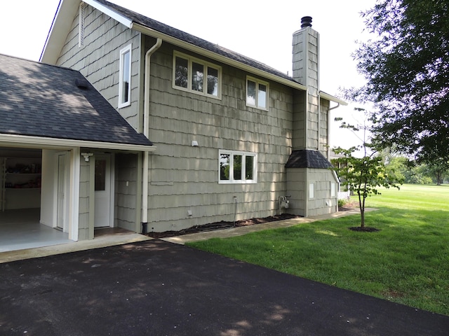 13 Scotland Dr, Frankfort, KY 40601 - view of property exterior featuring a shingled roof, a chimney, and a yard