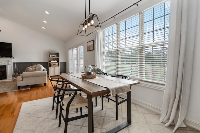 195 Couch Baker Ln, London, KY 40744 - dining space with vaulted ceiling, light wood finished floors, recessed lighting, and a glass covered fireplace