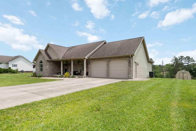 195 Couch Baker Ln, London, KY 40744 - ranch-style house with an attached garage, concrete driveway, a front lawn, brick siding, and a storage unit