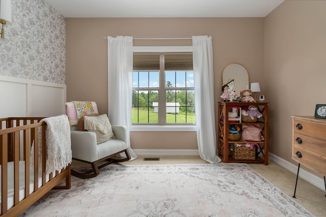 195 Couch Baker Ln, London, KY 40744 - bedroom featuring carpet floors, wallpapered walls, a wainscoted wall, and a nursery area