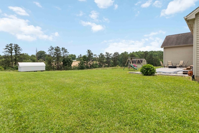195 Couch Baker Ln, London, KY 40744 - view of green lawn with a playground and a patio area