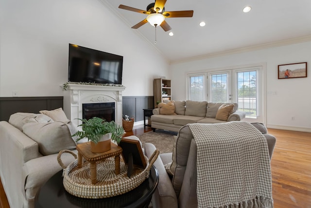 195 Couch Baker Ln, London, KY 40744 - living area featuring vaulted ceiling, ornamental molding, a ceiling fan, light wood-style flooring, and a wainscoted wall