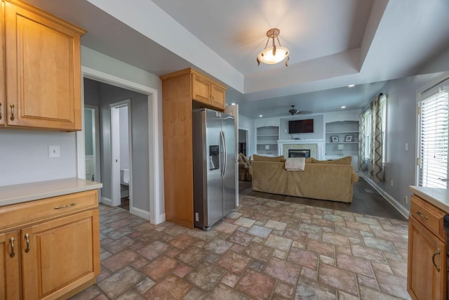 106 Squires Pointe Rd, Paris, KY 40361 - kitchen with stainless steel fridge, a fireplace, open floor plan, ceiling fan, and light countertops
