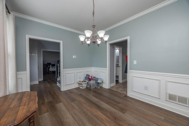 106 Squires Pointe Rd, Paris, KY 40361 - dining space featuring a chandelier, ornamental molding, dark wood-type flooring, wainscoting, and a decorative wall