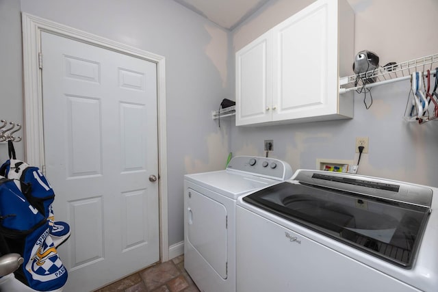 106 Squires Pointe Rd, Paris, KY 40361 - laundry area with cabinet space, washing machine and dryer, and stone finish floors